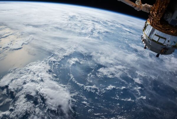 Satellite orbiting above Earth, illustrating verification and evidence in on-chain gaming