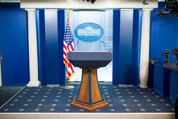 The empty White House briefing room podium, set up and ready before a speech