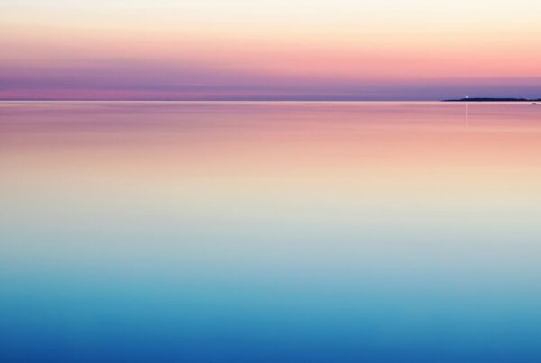 Calm flat sea at the horizon, representing Bitcoin volatility at a cycle low