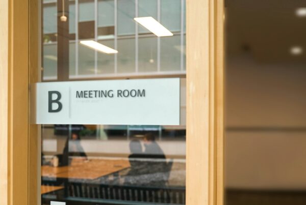 A frosted glass door with a sign reading Meeting Room B