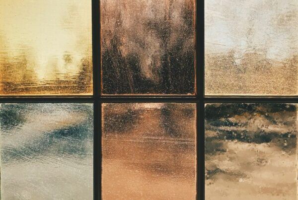 Six panes of frosted, opaque glass in a dark window frame, none of them see-through