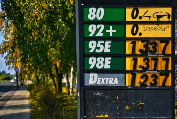 A roadside fuel price board with numbers slotted in by hand, two rows left blank