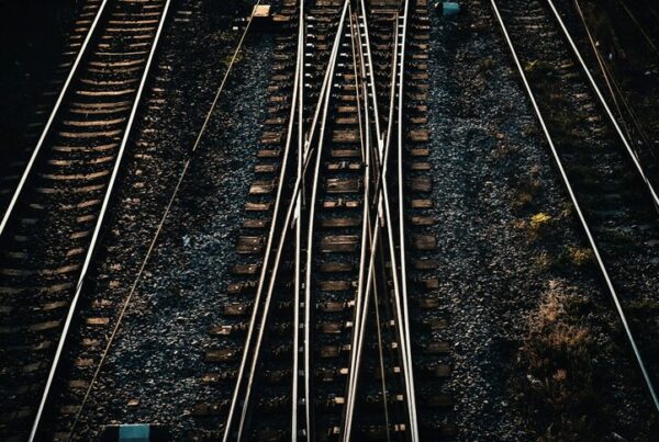 Converging railway tracks with crossover points, seen from above